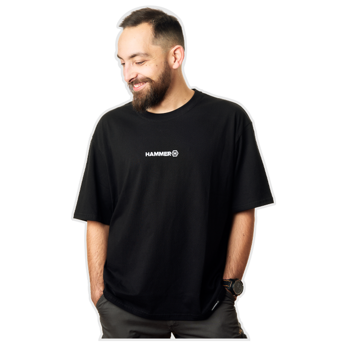 The man smiles, wearing a HAMMER T-SHIRT PREMIUM