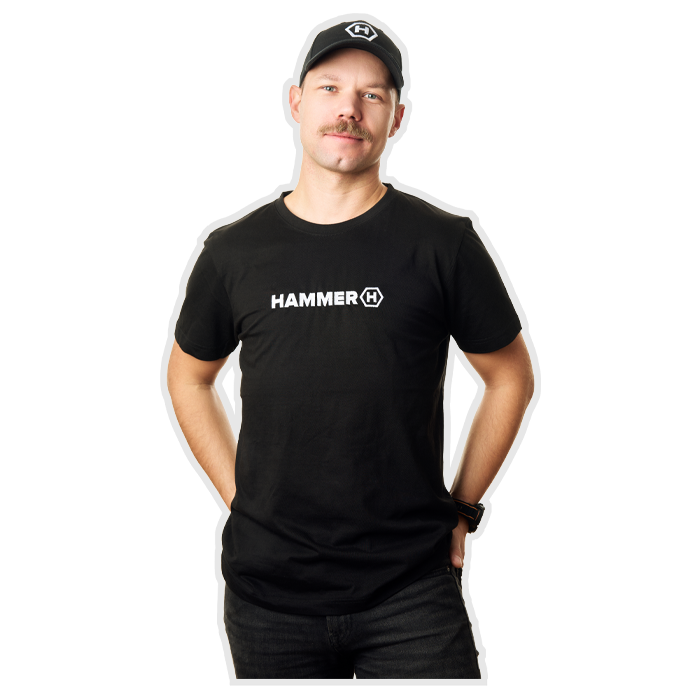The man smiles, wearing a HAMMER T-SHIRT BASIC